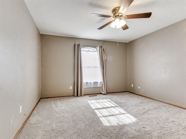 407 Heather Ln, Tuttle, OK 73089 - empty room featuring carpet, a ceiling fan, and baseboards