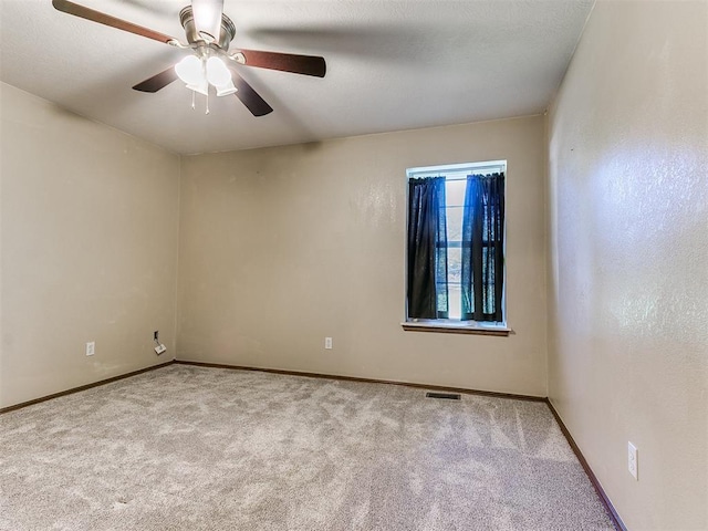407 Heather Ln, Tuttle, OK 73089 - carpeted empty room with baseboards and ceiling fan