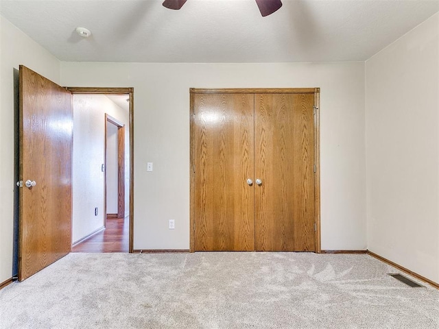 407 Heather Ln, Tuttle, OK 73089 - unfurnished bedroom with carpet flooring, a closet, and baseboards