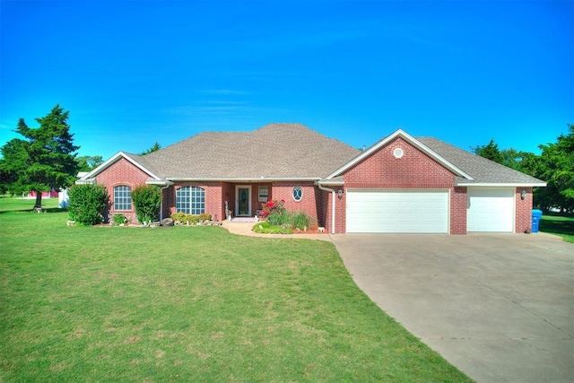 407 Heather Ln, Tuttle, OK 73089 - view of front facade featuring an attached garage, concrete driveway, brick siding, and a front lawn