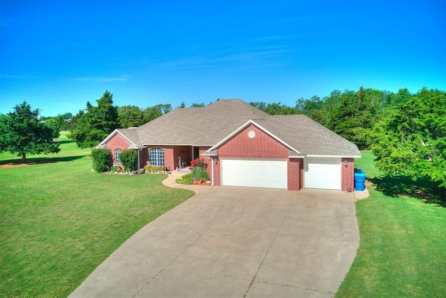 407 Heather Ln, Tuttle, OK 73089 - view of front facade with an attached garage, driveway, a front yard, and brick siding