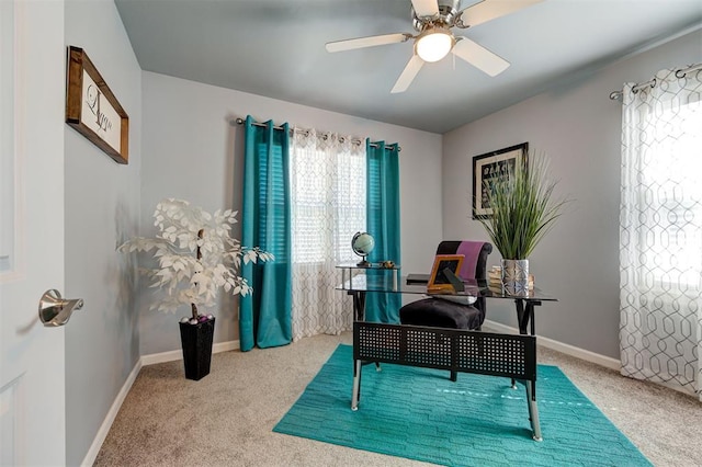 office area featuring baseboards, a ceiling fan, and carpet floors