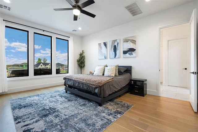 2109 Wiregrass Rd, Edmond, OK 73025 - bedroom featuring light wood-style flooring, recessed lighting, and a ceiling fan