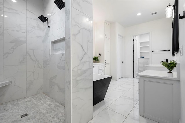 2109 Wiregrass Rd, Edmond, OK 73025 - full bath featuring vanity, a marble finish shower, marble finish flooring, recessed lighting, and a walk in closet