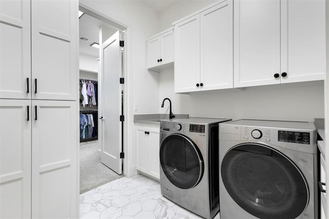 2109 Wiregrass Rd, Edmond, OK 73025 - laundry room with cabinet space and independent washer and dryer