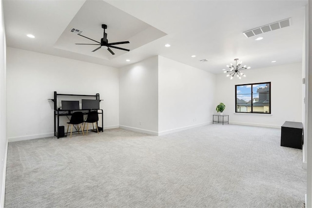 2109 Wiregrass Rd, Edmond, OK 73025 - unfurnished living room featuring light carpet, a chandelier, recessed lighting, ceiling fan, and a tray ceiling