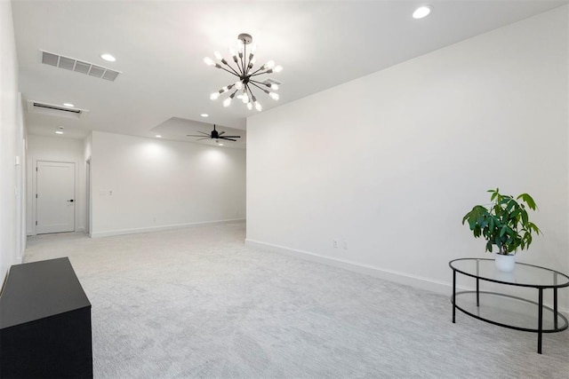 2109 Wiregrass Rd, Edmond, OK 73025 - spare room with a chandelier, a ceiling fan, light colored carpet, and recessed lighting