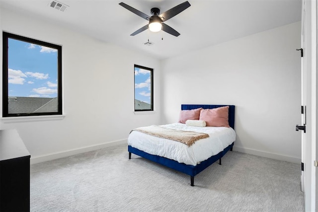 2109 Wiregrass Rd, Edmond, OK 73025 - carpeted bedroom with baseboards and ceiling fan