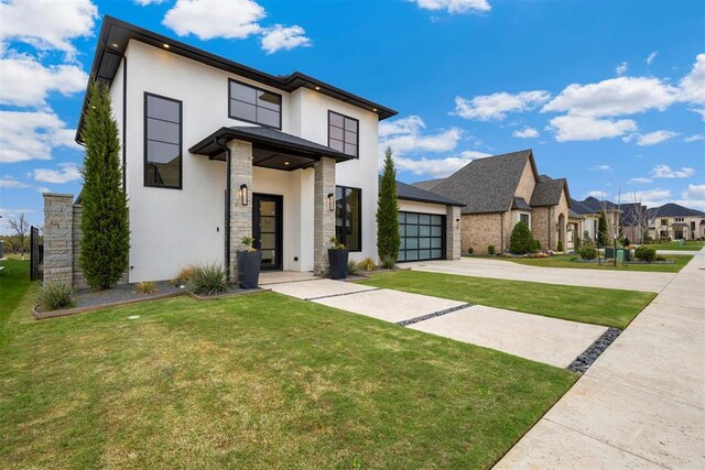 2109 Wiregrass Rd, Edmond, OK 73025 - contemporary house with stucco siding, concrete driveway, stone siding, a front yard, and a residential view