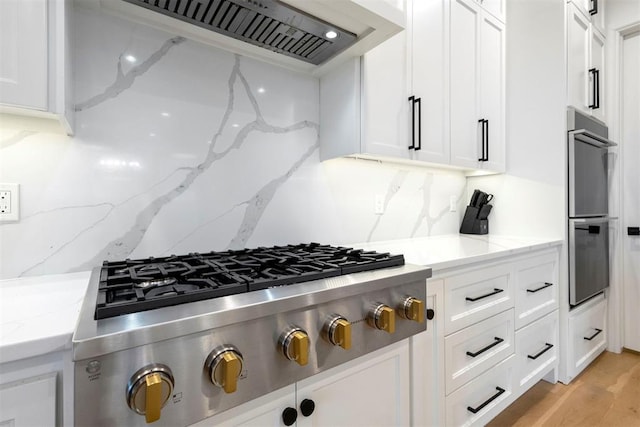 2109 Wiregrass Rd, Edmond, OK 73025 - kitchen with stainless steel appliances, premium range hood, and white cabinets
