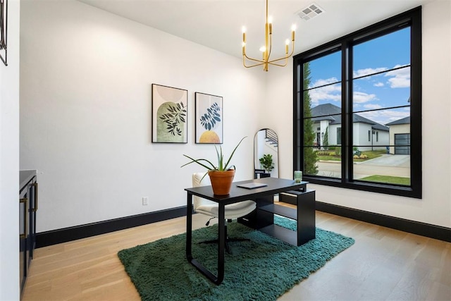 2109 Wiregrass Rd, Edmond, OK 73025 - office space with a chandelier, light wood-style floors, and expansive windows
