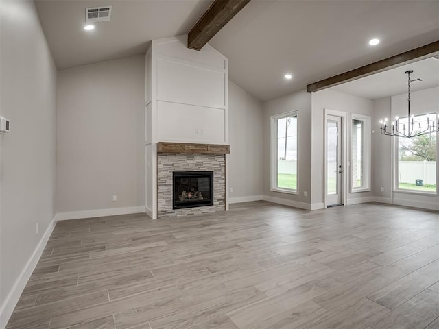 15216 Bedford Rd, Edmond, OK 73013 - unfurnished living room featuring vaulted ceiling with beams, light wood-style flooring, baseboards, visible vents, and an inviting chandelier