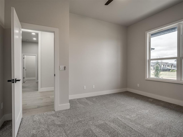 15216 Bedford Rd, Edmond, OK 73013 - unfurnished bedroom featuring baseboards and carpet flooring