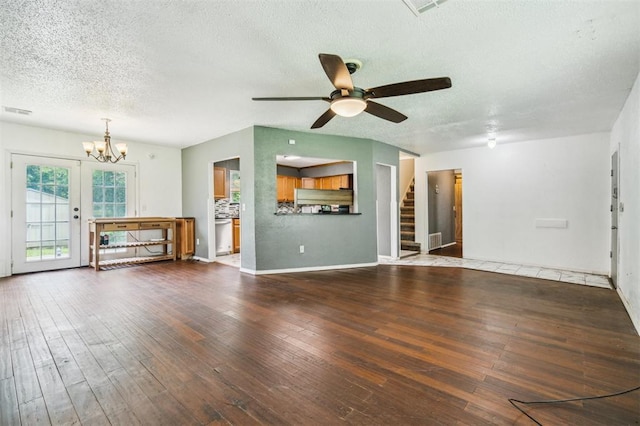 3206 Oakbriar Dr, Choctaw, OK 73020 - unfurnished living room with a textured ceiling, a ceiling fan, stairway, a chandelier, and hardwood / wood-style floors