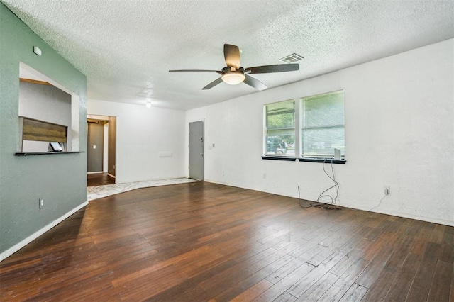 3206 Oakbriar Dr, Choctaw, OK 73020 - unfurnished room featuring ceiling fan, wood-type flooring, and a textured ceiling