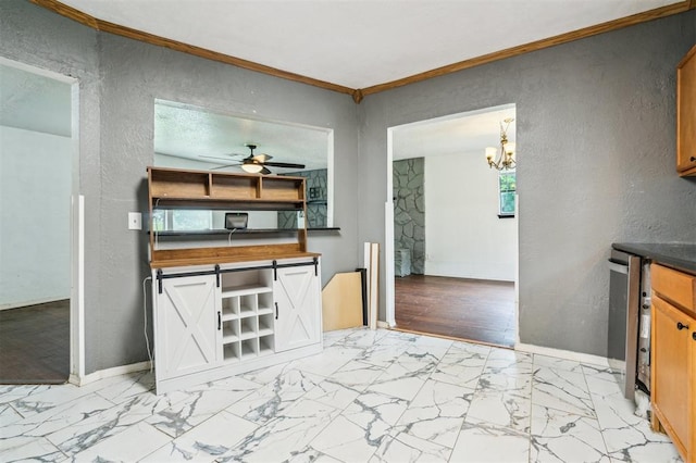 3206 Oakbriar Dr, Choctaw, OK 73020 - kitchen with a ceiling fan, a textured wall, ornamental molding, a chandelier, and baseboards