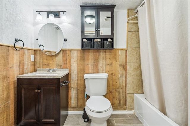 3206 Oakbriar Dr, Choctaw, OK 73020 - bathroom with vanity, toilet, shower / tub combo with curtain, wainscoting, and wood walls
