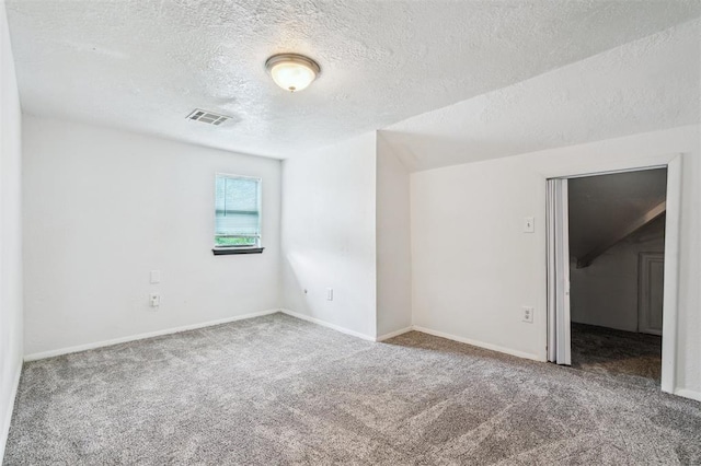 3206 Oakbriar Dr, Choctaw, OK 73020 - carpeted spare room featuring a textured ceiling and baseboards