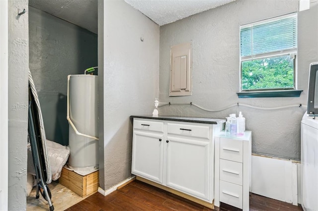 3206 Oakbriar Dr, Choctaw, OK 73020 - laundry room with electric panel, a textured wall, dark wood-style floors, and water heater