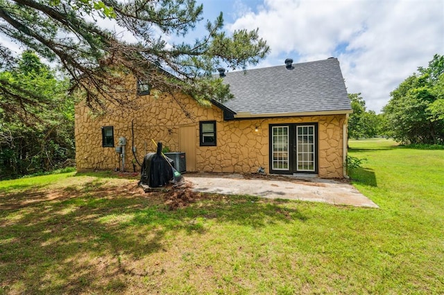 3206 Oakbriar Dr, Choctaw, OK 73020 - rear view of property featuring stone siding, roof with shingles, french doors, a yard, and a patio area