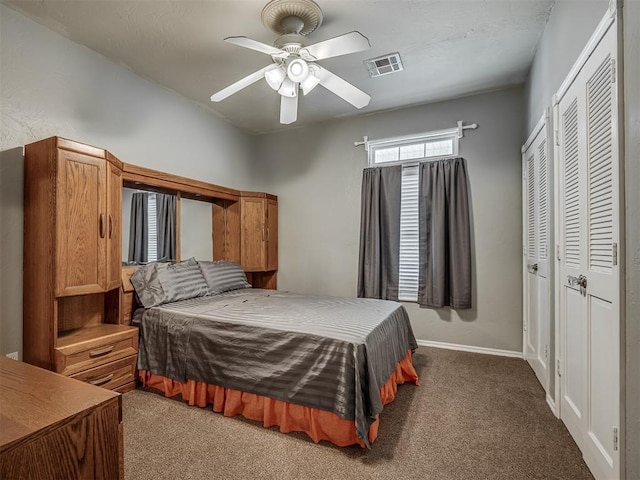 bedroom with a ceiling fan, a closet, carpet, baseboards, and visible vents