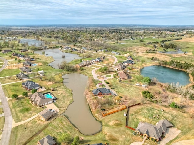 aerial view featuring a water view and a residential view