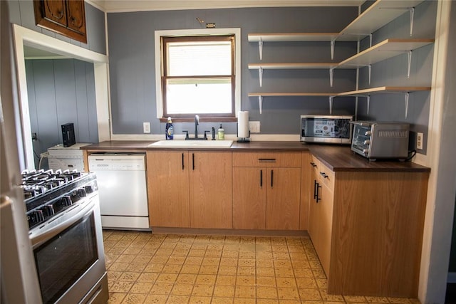 1011 W Mansur Ave, Guthrie, OK 73044 - kitchen with appliances with stainless steel finishes, light floors, dark countertops, and open shelves