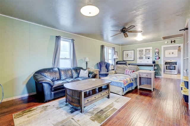 1011 W Mansur Ave, Guthrie, OK 73044 - living area featuring ceiling fan, plenty of natural light, hardwood / wood-style flooring, ornamental molding, and attic access