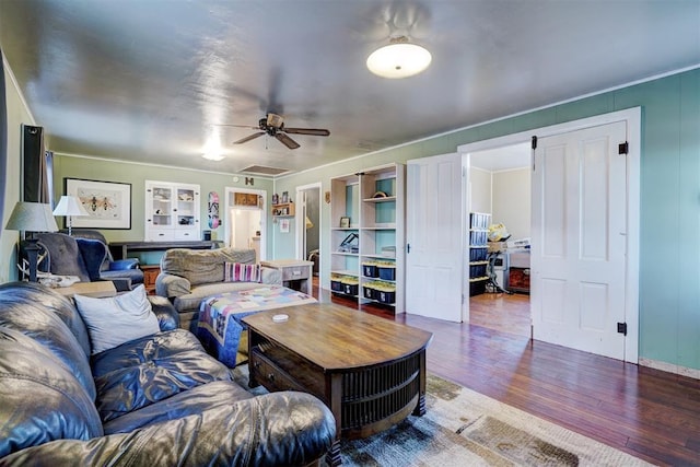1011 W Mansur Ave, Guthrie, OK 73044 - living room featuring wood finished floors, ceiling fan, and crown molding