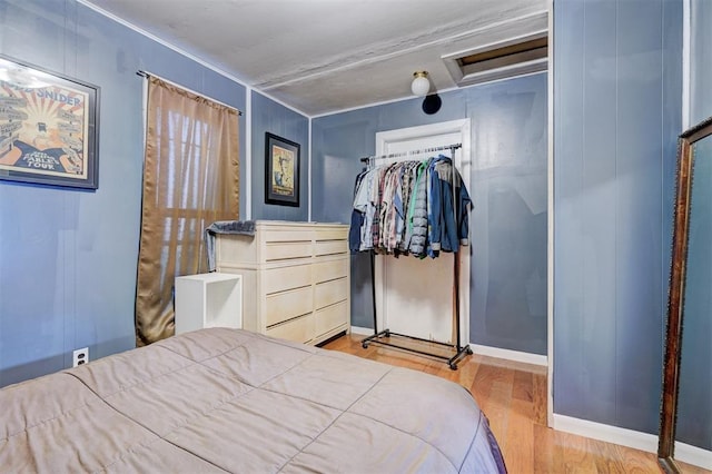 1011 W Mansur Ave, Guthrie, OK 73044 - bedroom featuring attic access and wood finished floors