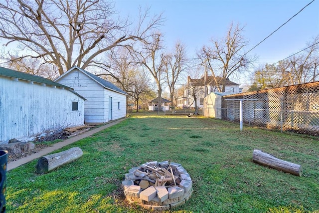 1011 W Mansur Ave, Guthrie, OK 73044 - fenced backyard with a fire pit
