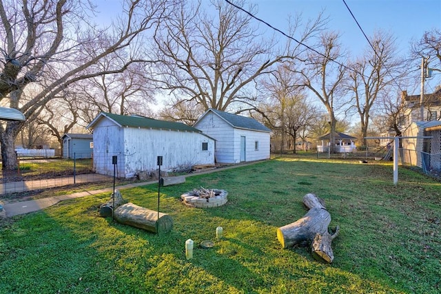 1011 W Mansur Ave, Guthrie, OK 73044 - view of yard with an outbuilding and an outdoor fire pit