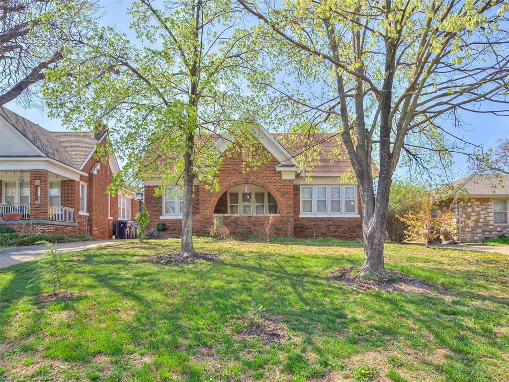 1616 NW 41st St, Oklahoma City, OK 73118 - view of front facade featuring brick siding and a front yard