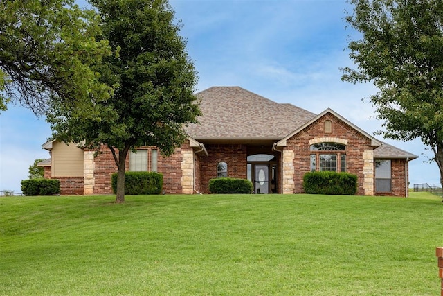 6574 Mint Julep Ln, Guthrie, OK 73044 - view of front of property with a front lawn, brick siding, and roof with shingles