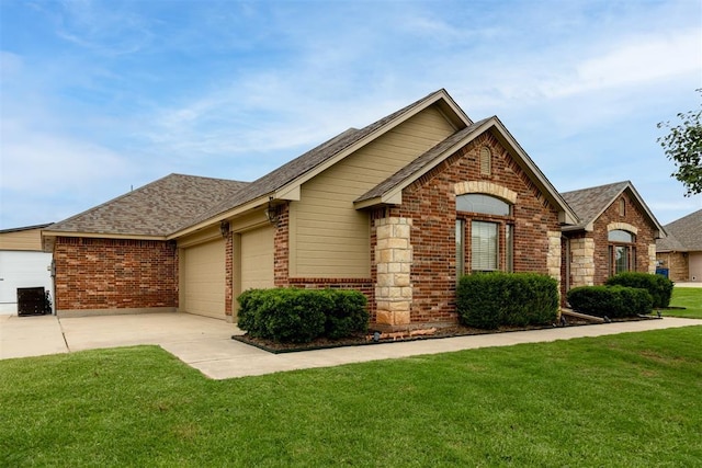 6574 Mint Julep Ln, Guthrie, OK 73044 - ranch-style home with brick siding, a garage, driveway, a front lawn, and roof with shingles