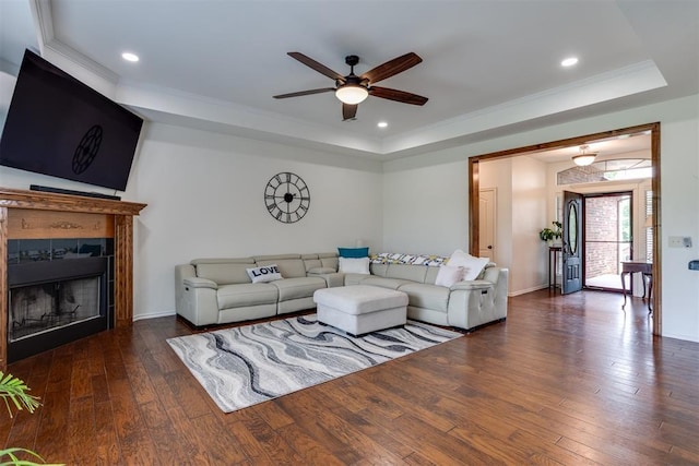 6574 Mint Julep Ln, Guthrie, OK 73044 - living room with a tray ceiling, a ceiling fan, hardwood / wood-style floors, ornamental molding, and recessed lighting