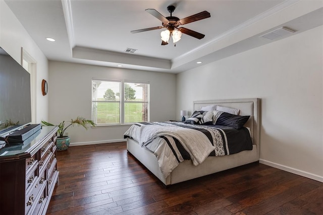 6574 Mint Julep Ln, Guthrie, OK 73044 - bedroom with a raised ceiling, dark wood-style floors, a ceiling fan, recessed lighting, and ornamental molding