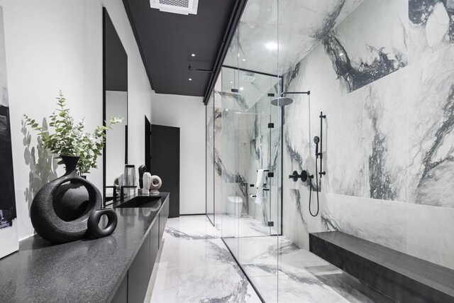 518 Colcord Dr, Oklahoma City, OK 73102 - full bath featuring marble finish floor, visible vents, a marble finish shower, and vanity