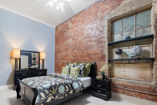 518 Colcord Dr, Oklahoma City, OK 73102 - bedroom featuring baseboards, ceiling fan, carpet, and brick wall
