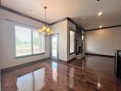 708 Kearny Ln, Yukon, OK 73099 - unfurnished dining area featuring ornamental molding, a chandelier, wood finished floors, recessed lighting, and a fireplace
