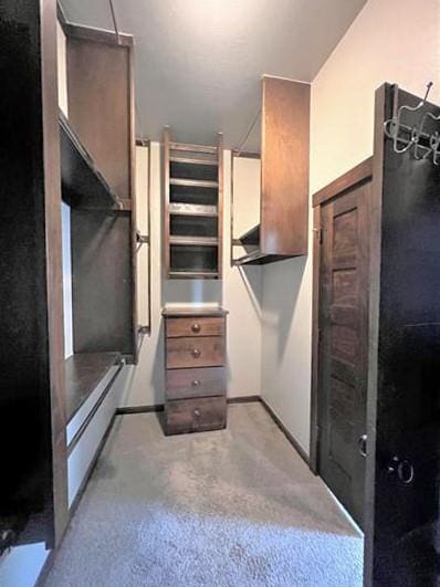 708 Kearny Ln, Yukon, OK 73099 - spacious closet featuring light colored carpet