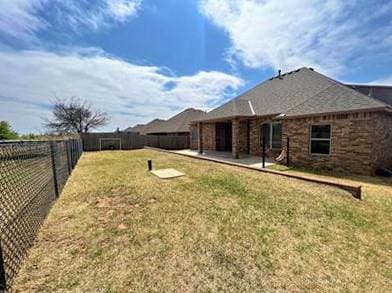 708 Kearny Ln, Yukon, OK 73099 - back of house featuring a fenced backyard and a patio area
