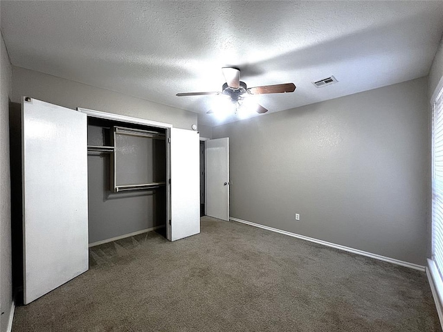 713 NW 143rd St, Edmond, OK 73013 - unfurnished bedroom featuring carpet flooring, a closet, and ceiling fan
