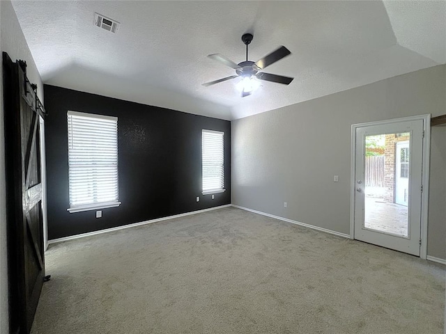 713 NW 143rd St, Edmond, OK 73013 - empty room featuring ceiling fan, carpet flooring, a textured ceiling, and vaulted ceiling
