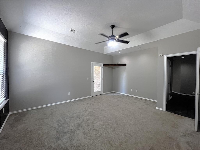 713 NW 143rd St, Edmond, OK 73013 - unfurnished bedroom with carpet, ceiling fan, lofted ceiling, and a textured ceiling