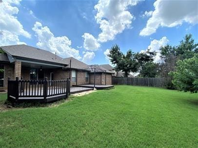 713 NW 143rd St, Edmond, OK 73013 - fenced backyard featuring a deck