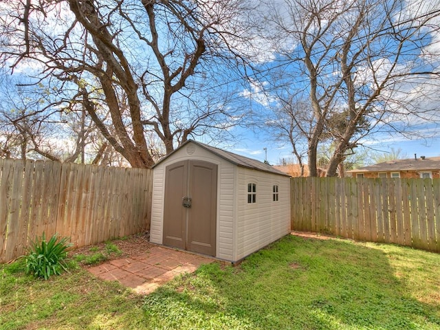 view of shed featuring a fenced backyard