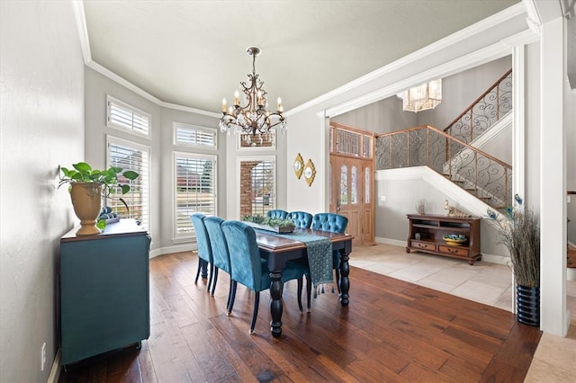 2817 Sweetbriar Way, Edmond, OK 73034 - dining area featuring a chandelier, crown molding, stairs, hardwood / wood-style floors, and baseboards