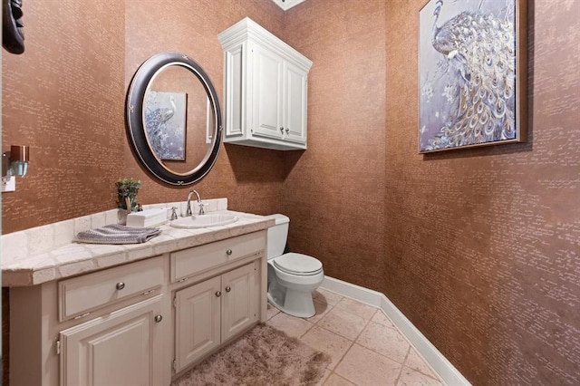 2817 Sweetbriar Way, Edmond, OK 73034 - half bathroom with toilet, vanity, wallpapered walls, baseboards, and tile patterned floors