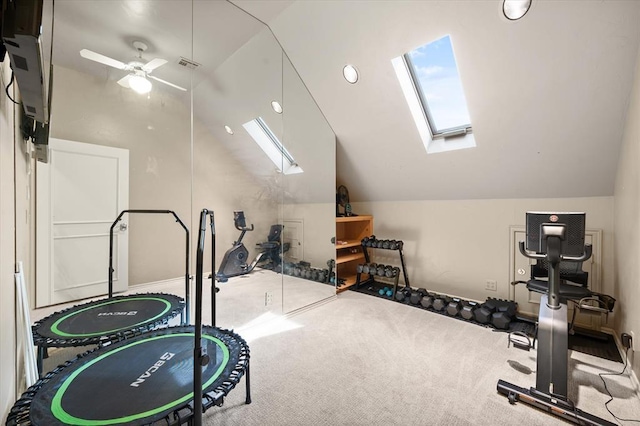 2817 Sweetbriar Way, Edmond, OK 73034 - workout area featuring a skylight, lofted ceiling, a ceiling fan, and carpet flooring